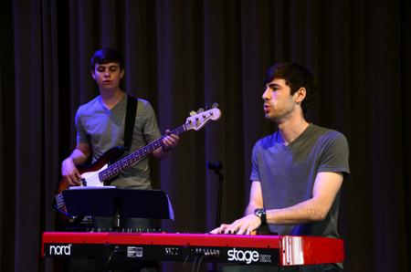 Brad Carrington (right), senior church music major, and Andrew Key, sophomore broadcast journalism major, help lead worship during chapel.  - Photo by Anne Richoux