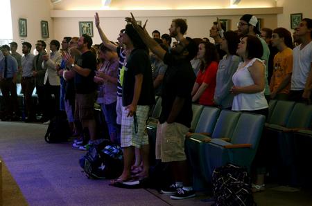 Students gather for worship in chapel, led by Travis Cottrell, worship pastor at Englewood Baptist Church.  - Photo by Anne Richoux