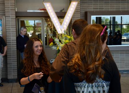 Jamie Blurton, junior social work major, greets attendees at the 15th annual Variety Show, held at the Carl Perkins Civic Center. - Photo by Jacob Moore