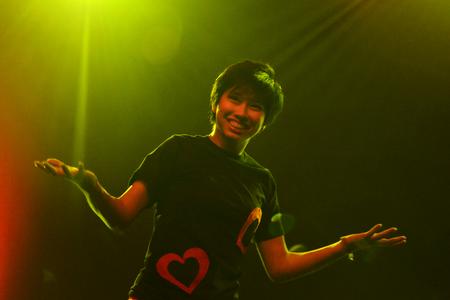 Anna Loi, freshman journalism major, performs with members of the independent group 'The Hopeful Rascals' during the 15th annual Variety Show. - Photo by Jacob Moore