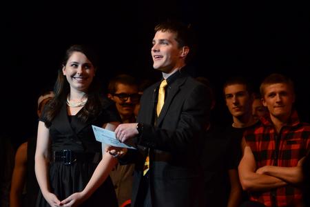 SAC members AlLee Browning, junior elementary education major, and Matt Parker, senior business administration major, announce category winners during the 15th annual Variety Show. - Photo by Jacob Moore