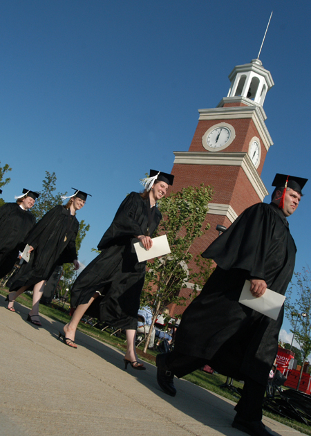 Graduates Amber Bostwick, Catherine Bland, Sarah Belcher and Jason Griggs lead the student processional at spring commencement. - Photo by Jonathan Blair