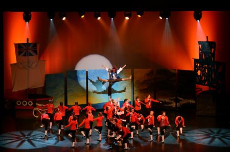 Claudia Velasco, junior accounting major, playing the part of Jack Sparrow, is tossed in the air during Zeta Tau Alpha's performance for the 15th annual Variety Show. - Photo by Anne Richoux