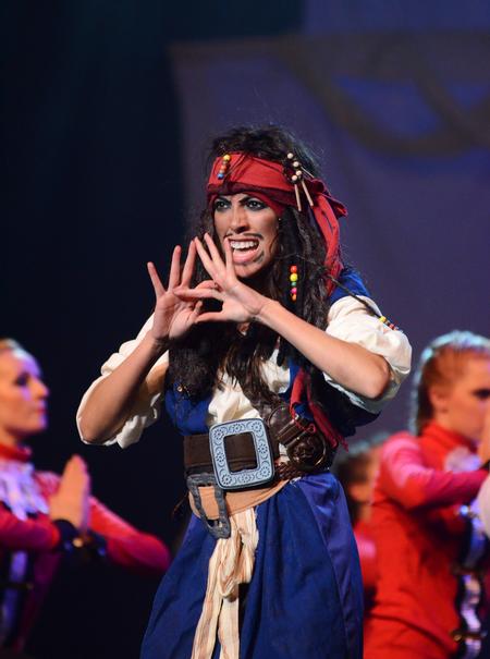 Claudia Velasco, junior accounting major, performs the role of Jack Sparrow and throws the Zeta crown symbol during the stomp number in the Zeta Tau Alpha act at the 15th Annual Variety Show. - Photo by Zac Calvert