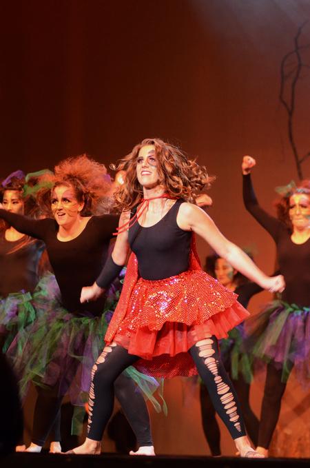 Tabitha Higgins, junior social work major, performs as Little Red Riding Hood during the act by the independent group "Once Upon A Time" during the 15th Annual Variety Show. - Photo by Zac Calvert