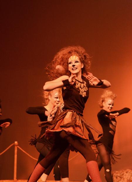 Shea Wingate, sophomore political science major, performs the role of Nala from the Lion King in Chi Omega's act during the 15th Annual Variety Show. - Photo by Zac Calvert