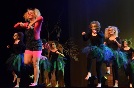 Cassie Osborn, junior social work major, performs as one of the three little pigs along with other "Once Upon A Time" members at the 15th Annual Variety Show.  - Photo by Ebbie Davis