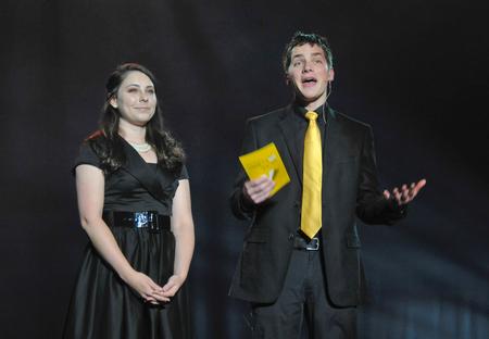 SAC members AlLee Browning, junior elementary education major, and Matt Parker, senior business administration major, announce category winners during the 15th annual Variety Show. - Photo by Morris Abernathy