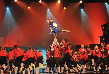 Claudia Velasco, junior accounting major, stands tall as she says farewell at Zeta Tau Alpha's performance in the 15th annual Variety Show. - Photo by Morris Abernathy