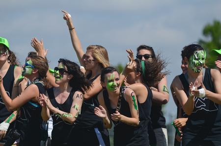 Kappa Delta members Allison Gooch, senior biology major, Caisie Jordan, sophomore special education major, and Mary Jane Garrott, junior art major, celebrate after winning the football toss during Greek Olympics. - Photo by Zac Calvert