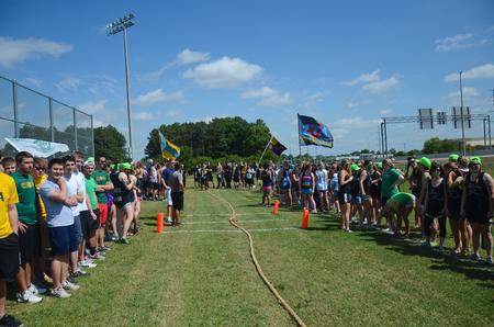 The Greek organizations line up before the rope pull to cheer on their fraternity members during Greek Olympics. - Photo by Zac Calvert