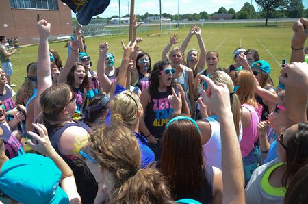 Heather Dragg, senior psychology major, leads Zeta Tau Alpha in a cheer during Greek Olympics. - Photo by Zac Calvert