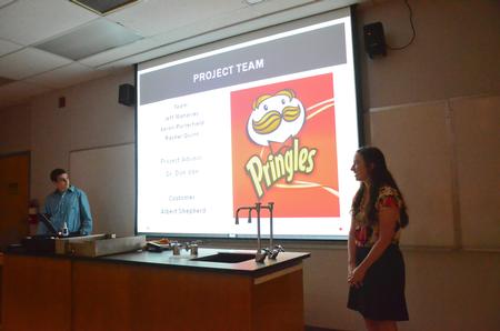 Aaron Porterfield and Rachel Quinn, senior engineering majors, present their project on building a cleaning robot for the Pringles Plant in Jackson during the Ninth Annual Scholarship Symposium. - Photo by Zac Calvert