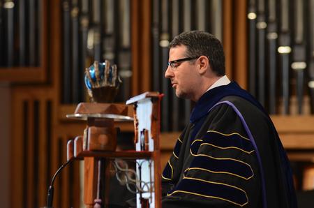 Keith Bates, associate professor of history and 2011 Faculty of the Year, leads a prayer during the annual Awards Day chapel service. - Photo by Jacob Moore
