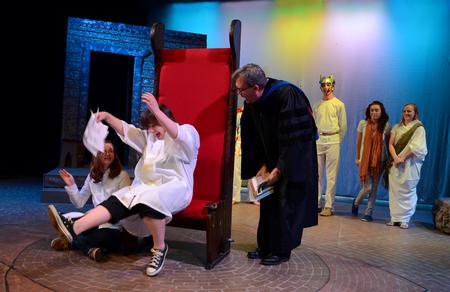 Gavin Richardson, professor of English, portrays God yelling at Lucifer, played by Mary Laarz, junior English major, during a dramatic reading of "The Fall of Lucifer" as part of the Scholarship Symposium. - Photo by Jacob Moore