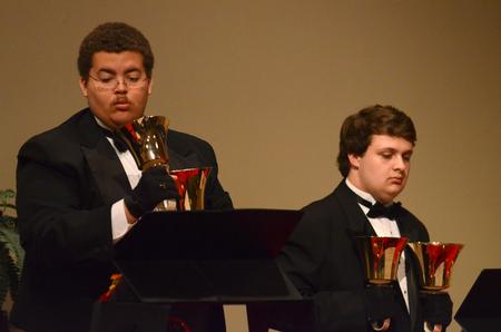 Cedric Townsend and Doug May, freshman music majors, perform with the Handbell Choir at Luther Hall. - Photo by Jacob Moore