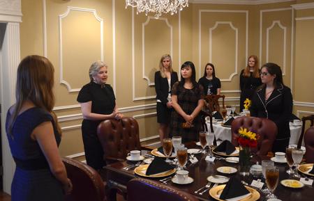 Lanese Dockery, first lady of the university, explains the process of dining in a formal situation during the 2012 Etiquette Dinner, hosted by the Vocatio Center for Life Calling and Career. - Photo by Jacob Moore