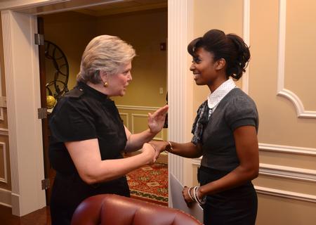 Lanese Dockery, first lady of the university, talks with Melanie Taylor, junior sports management major, during the 2012 Etiquette Dinner. - Photo by Jacob Moore