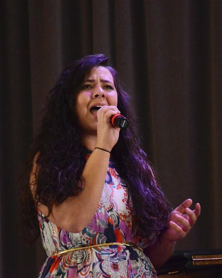 Megan Thompson, senior art major, sings during a chapel that art students put together.  The service focused on the question "Do you enjoy your salvation?" - Photo by Zac Calvert