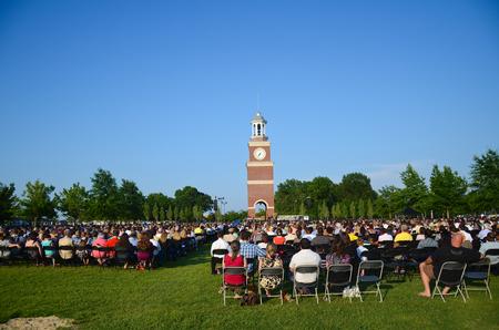 Family and friends gather to watch and celebrate spring graduation on the Great Lawn. - Photo by Zac Calvert