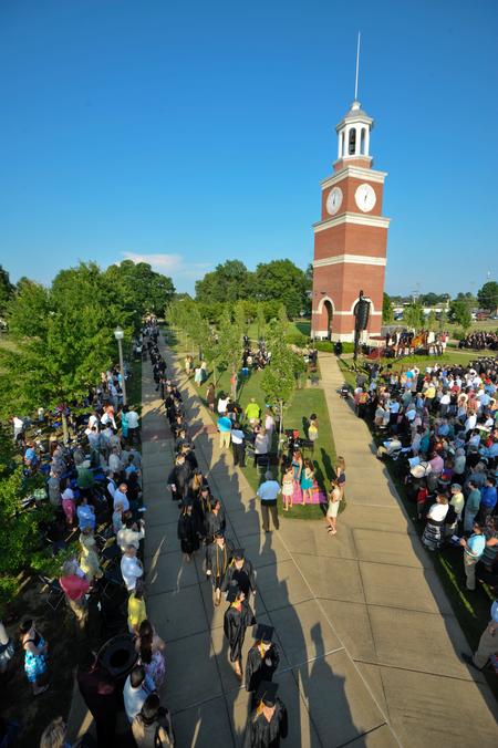 During the 187th annual spring graduation, David S. Dockery, president of the university, told a group of 614 graduates that faithfulness is a characteristic that marks the class of 2012. Here the line of graduates passes Miller Tower on the way to the Great Lawn. - Photo by Morris Abernathy