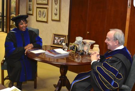 Carol M. Swain, professor of political science and law at Vanderbilt University, visits with David S. Dockery, president of the university, just before spring graduation where Swain is to give the commencement address. - Photo by Morris Abernathy