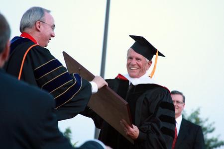 William Latimer, III, receives an honorary doctor of humanities degree during spring graduation. - Photo by Kristi McMurry Woody