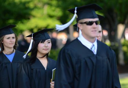 Shinae Giffin, art graduate, walks toward the Great Lawn with the class of 2012 at spring graduation. - Photo by Jacob Moore