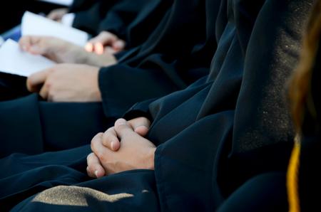 Graduates listen to the commencement address during spring graduation.  - Photo by Ebbie Davis