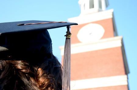 Graduates of the class of 2012 sit in front of Miller Tower on a sunny day during spring graduation.  - Photo by Ebbie Davis