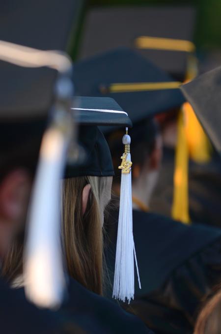 The class of 2012 listens to the commencement address and anxiously awaits their time to receive their diplomas. - Photo by Jacob Moore