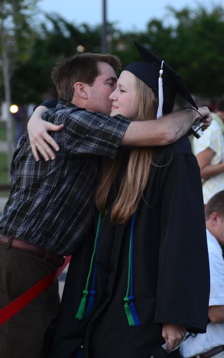 Katherine Pullen hugs her father Jerry Pullen after receiving the Elizabeth Tigrett Medal during spring graduation. - Photo by Jacob Moore