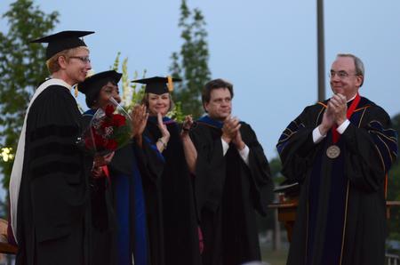 David S. Dockery, president of the university, leads a round of applause in appreciation for Barbara McMillin, associate provost and dean of instruction. McMillin has been named the new president of Blue Mountain College. - Photo by Jacob Moore