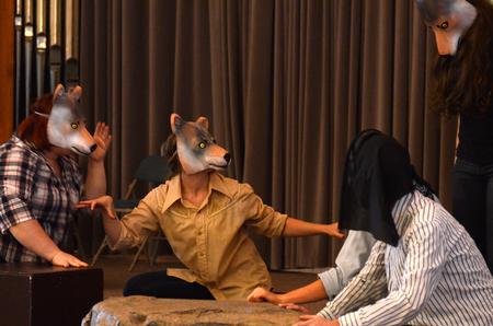 A group of students perform as wolves in the Spring children's play <em>The Saga of Pecos Bill (or How Comboyin' Really Got Started).</em> - Photo by Jacob Moore