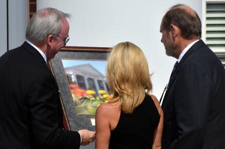 David S. Dockery, president of the university, presents Jim and Janet Ayers, major donors to the project, with a gift during the dedication of the new Hendersonville facility. - Photo by Morris Abernathy