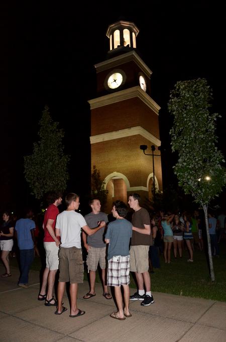 Connor Shelton, Matt Cole, Michael Cole, Andrew Pearson, and Seth Brake talk and laugh together during the Howdy Party on the Great Lawn.  - Photo by Anne Richoux