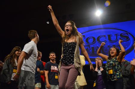 Shea Wingate, junior political science major, celebrates after winning a paper-rock-scissors tournament during the annual SAC game show. - Photo by Zac Calvert