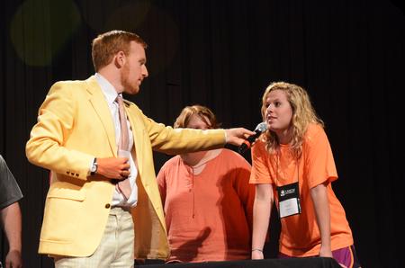 Ryan Linkous, senior biblical languages major, asks Carly Daniel, freshman business administration major, a question during the annual SAC game show.  - Photo by Zac Calvert