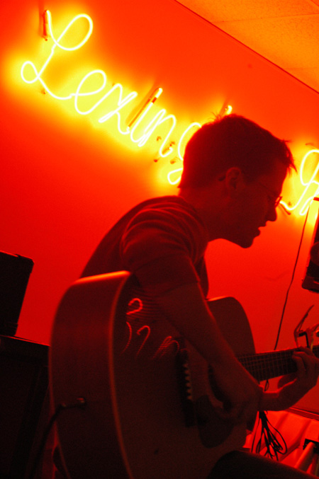 Freshman Josh Hall performs at Open Mic Night at the Lex during Homecoming 2004. - Photo by Lindsay Stavish