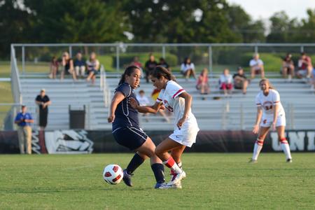 Lady Bulldog Sara Johnson drives past Alexis Baez of Missouri Baptist University during a home soccer game. - Photo by Jacob Moore