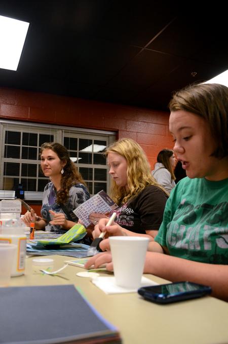 Nicole Bantoz, freshman pre-med major, Alyssa Jordan, freshman music major, and Alexa MacKay, sophomore Christian ministry and missions major, talk while working on crafts at Ladies Night, a residence life event, in the Bowld Student Commons.  - Photo by Anne Richoux