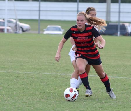 Megan Roney attacks the ball against the offense to get possession back. Union's women soccer team came out strong to defeat Belhaven University with a score of 1-0. - Photo by Ebbie Davis