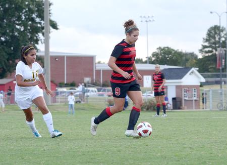 Whitney Kramer dribbles across field to get a better shot at the goal. The Lady Bulldogs came out strong to defeat Belhaven University with a score of 1-0. - Photo by Ebbie Davis