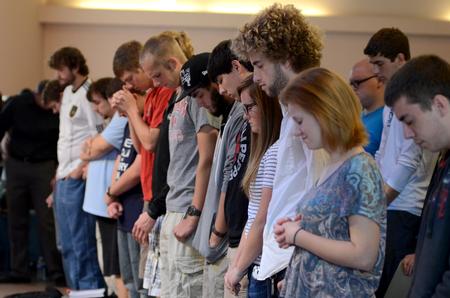 The student body worships though prayer while attending a chapel service.  - Photo by Ebbie Davis