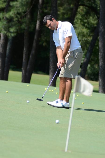 Kody Alexander practices his putting at the Country Club of Jackson. - Photo by Jacob Moore
