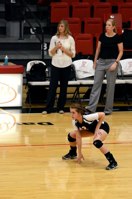 Jami Humphries, junior media communications major, prepares for the serve during a match against the University of West Florida. - Photo by Anne Richoux