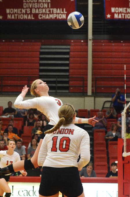 Kristin Cook, freshman psychology major, goes up to spike to ball during a game against University of Alabama-Huntsville. - Photo by Zac Calvert