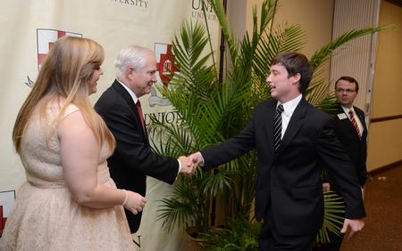 Luke Trammell, junior political science major, greets Robert M. Gates, former U.S. secretary of defense, after the 15th Annual Scholarship Banquet. - Photo by Jacob Moore