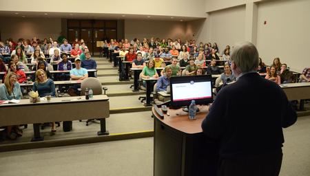 David S. Dockery, president of the university, answers questions from students at a Student Senate meeting in Harvey Auditorium. - Photo by Jacob Moore