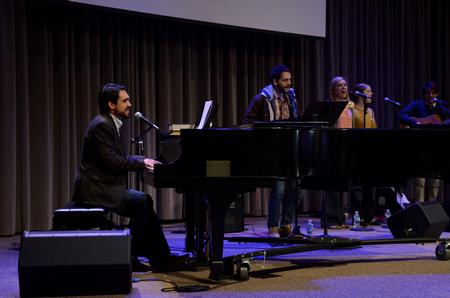 Cody Curtis, assistant residence director, leads worship music during the final chapel of Faith in Practice week.  - Photo by Anne Richoux